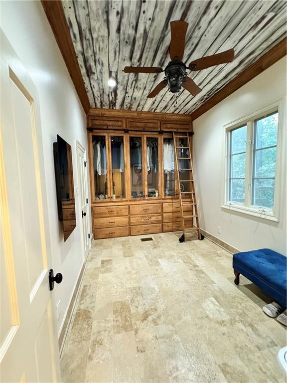 spare room featuring ceiling fan and wood ceiling