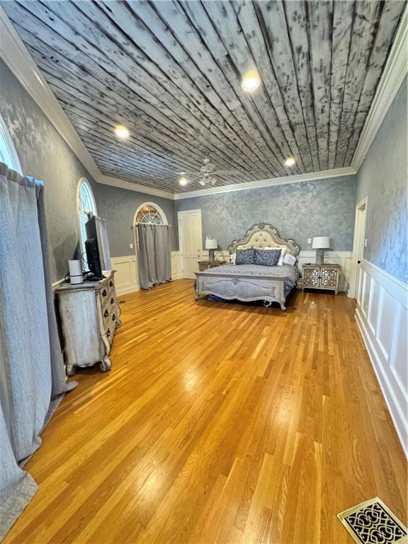 unfurnished bedroom with hardwood / wood-style floors and ornamental molding