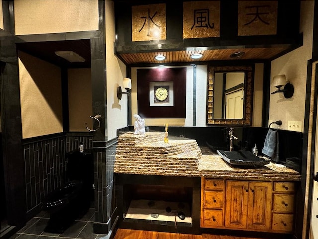 bathroom with tile patterned flooring and sink