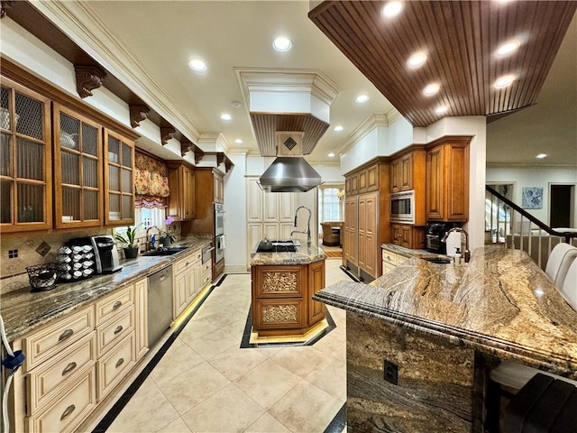 kitchen featuring stone counters, stainless steel appliances, kitchen peninsula, and ornamental molding