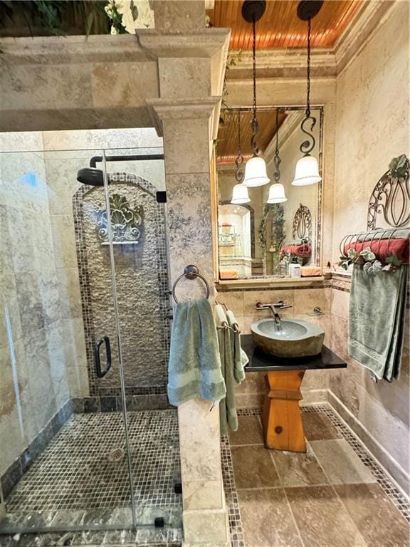 bathroom featuring wooden ceiling, walk in shower, and ornamental molding