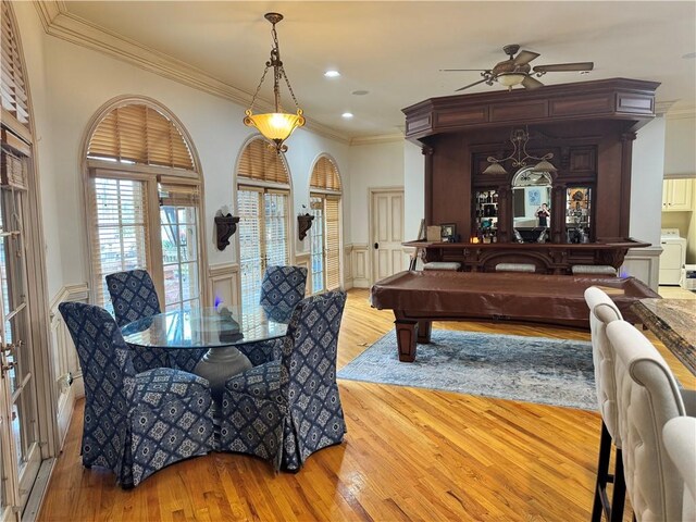 dining room featuring ceiling fan, light wood-type flooring, ornamental molding, and pool table