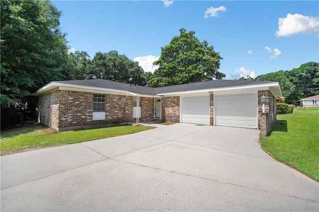 4205 Chesterfield Dr N, Mobile, AL 36618 - ranch-style home with a garage, concrete driveway, a front yard, and brick siding