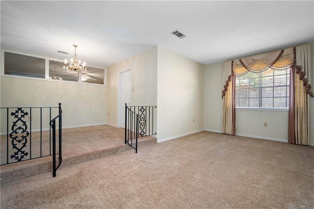 4205 Chesterfield Dr N, Mobile, AL 36618 - carpeted spare room featuring a chandelier and baseboards