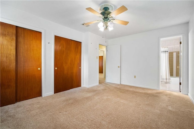 4205 Chesterfield Dr N, Mobile, AL 36618 - unfurnished bedroom with two closets, carpet flooring, baseboards, ensuite bathroom, and ceiling fan
