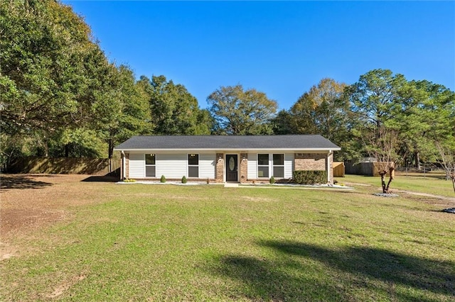 ranch-style home with a front lawn