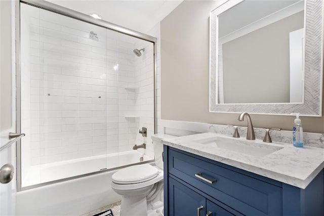 full bathroom with vanity, toilet, and enclosed tub / shower combo