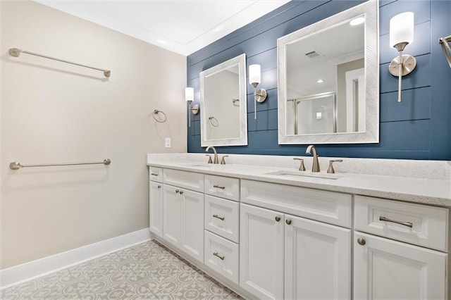 bathroom featuring crown molding, vanity, and walk in shower