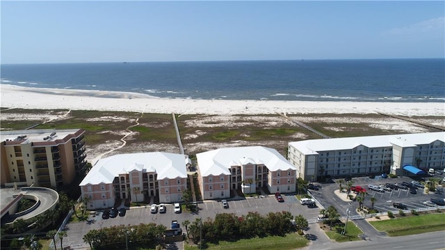 aerial view with a view of the beach and a water view