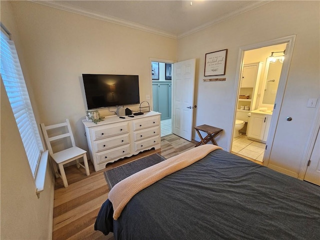 tiled bedroom featuring ornamental molding and connected bathroom