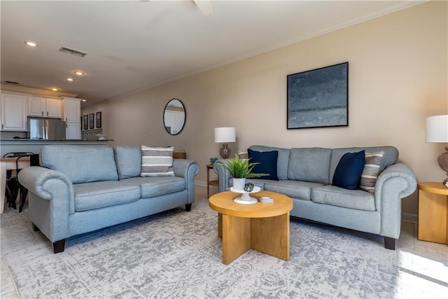 living room featuring crown molding