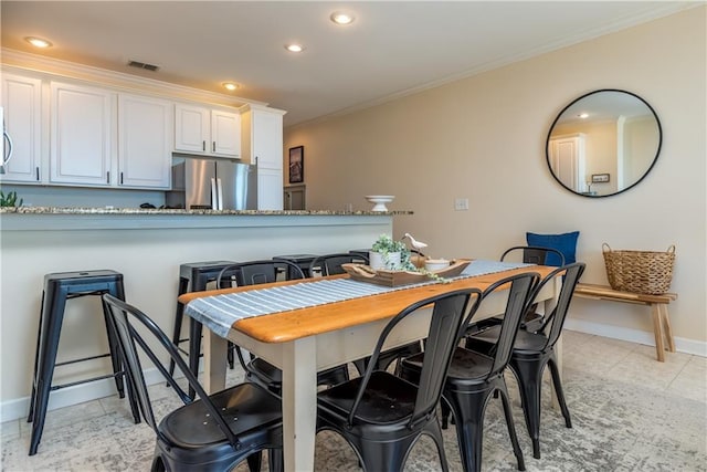 dining room with ornamental molding