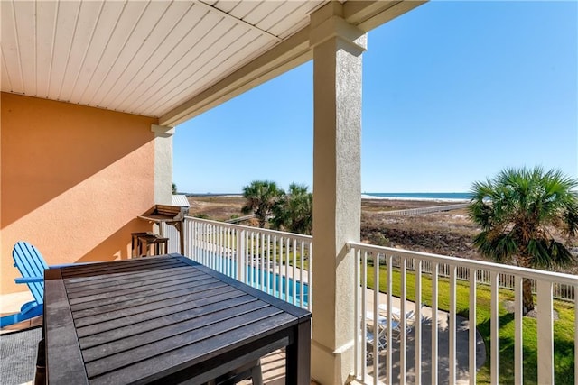 balcony featuring a water view