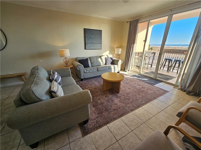 living room with tile patterned flooring, ornamental molding, and a water view