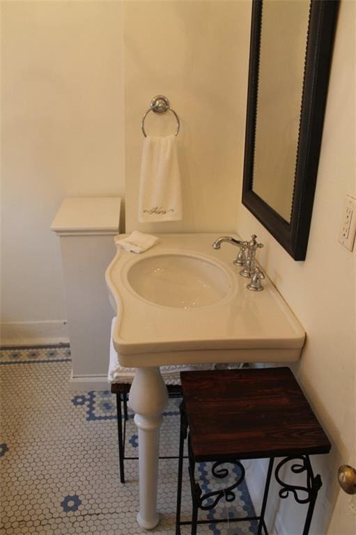 bathroom with tile flooring and toilet