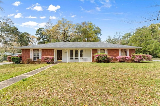 single story home featuring brick siding and a front lawn