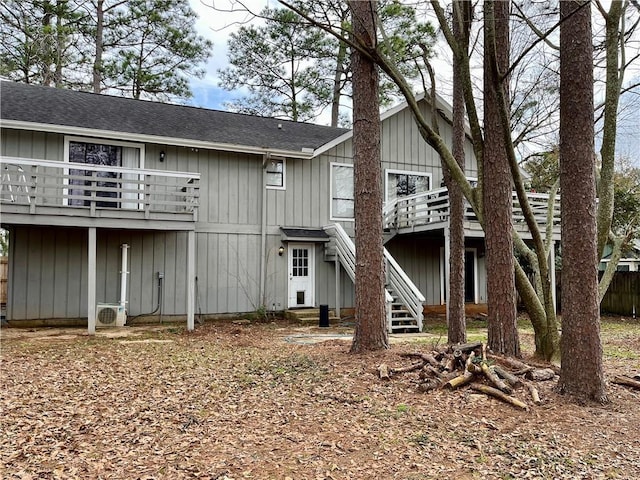 rear view of property featuring a deck