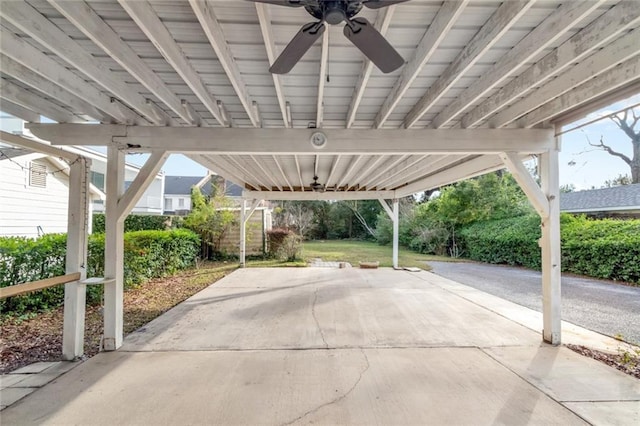 view of patio with ceiling fan and a carport