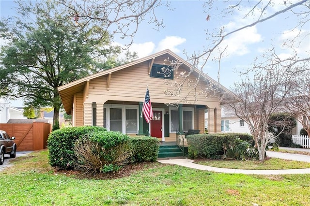 view of front of property with a front lawn and a porch