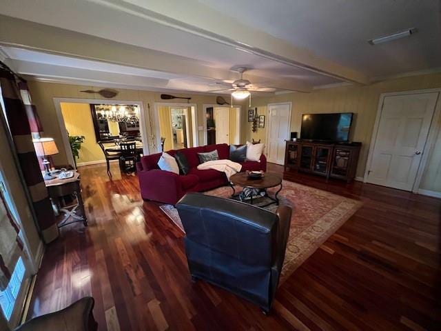 living room featuring baseboards, a ceiling fan, wood finished floors, and beamed ceiling