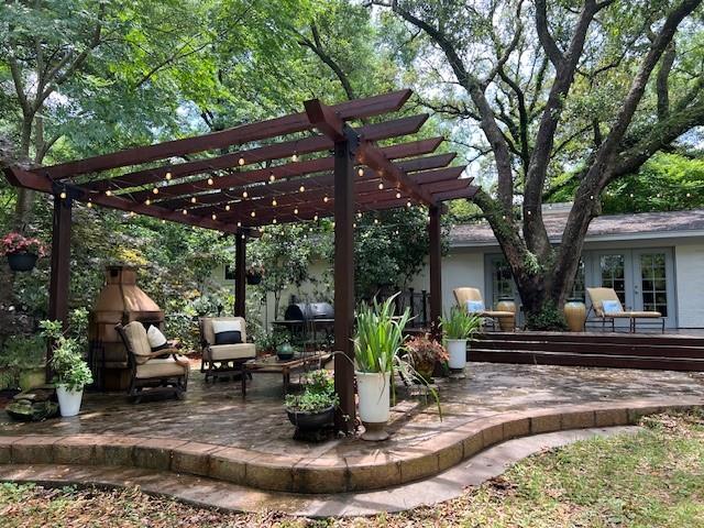 view of patio featuring french doors and a pergola