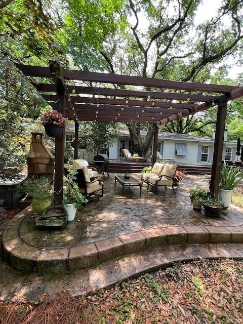 view of patio / terrace with a pergola and an outdoor living space