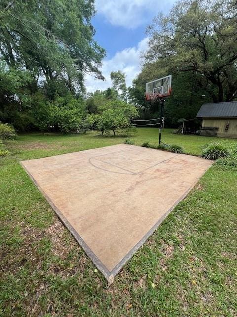 view of sport court with a lawn, basketball court, and volleyball court