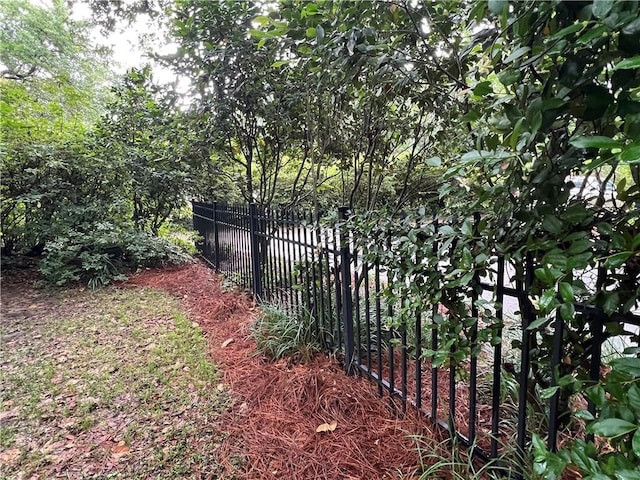 view of gate with fence