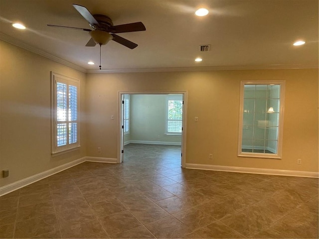 unfurnished room featuring crown molding and ceiling fan