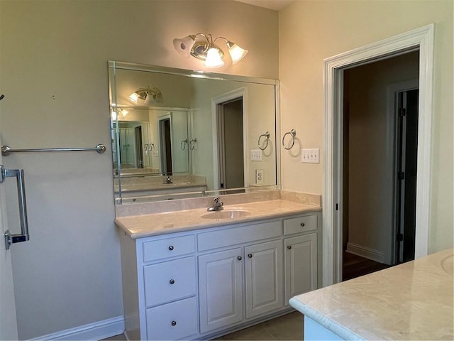 bathroom featuring vanity and tile patterned flooring