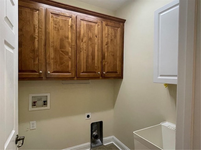 washroom with cabinets, washer hookup, and hookup for an electric dryer