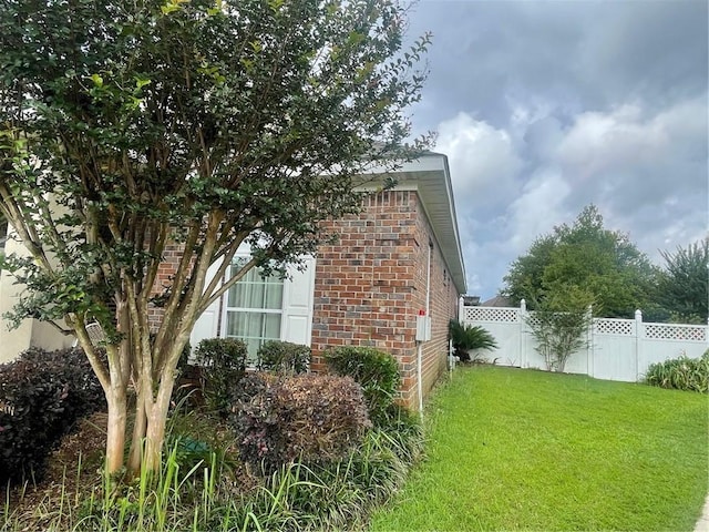 view of property exterior featuring a yard