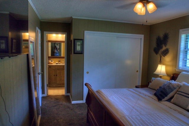 carpeted bedroom featuring ornamental molding and baseboards