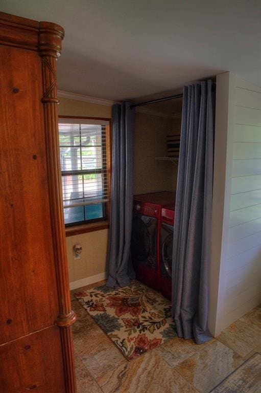 washroom featuring baseboards, laundry area, washer and clothes dryer, and crown molding