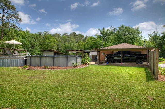 view of yard featuring an outdoor pool