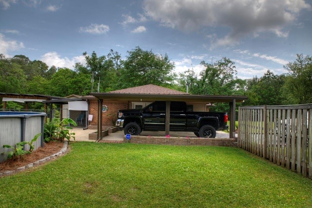 view of car parking featuring fence and an attached garage