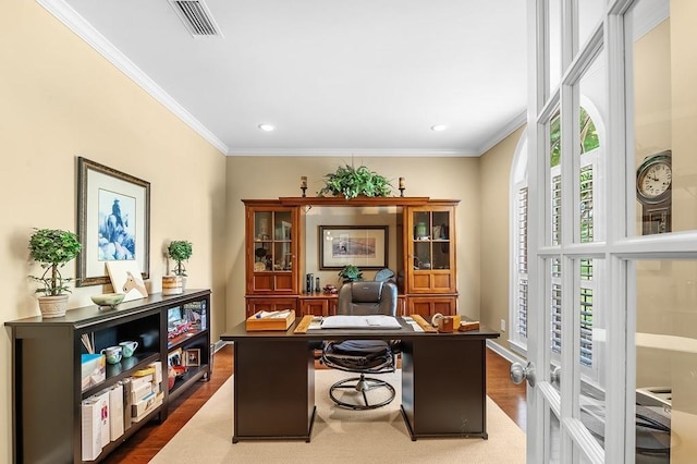 home office featuring crown molding and dark hardwood / wood-style floors