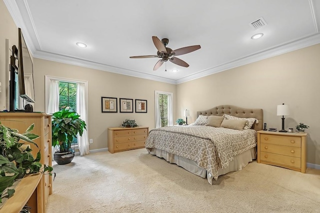 bedroom featuring ornamental molding, carpet flooring, and multiple windows