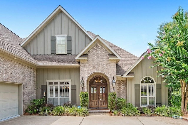 view of front of home with french doors and a garage