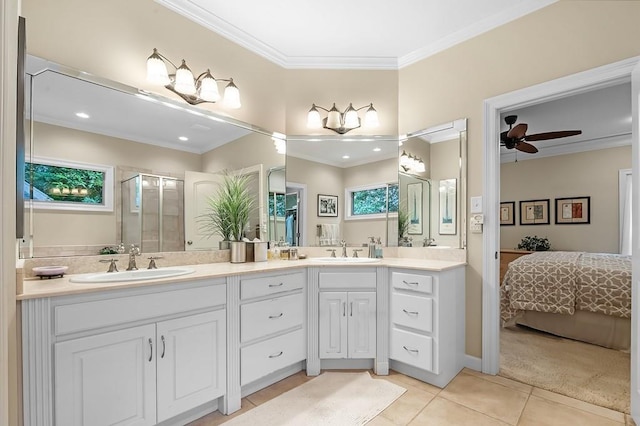 bathroom with walk in shower, tile patterned floors, crown molding, vanity, and ceiling fan