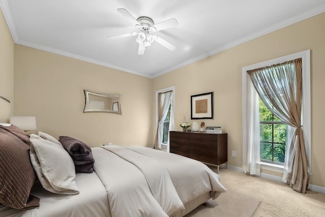 bedroom featuring ceiling fan, light colored carpet, and ornamental molding