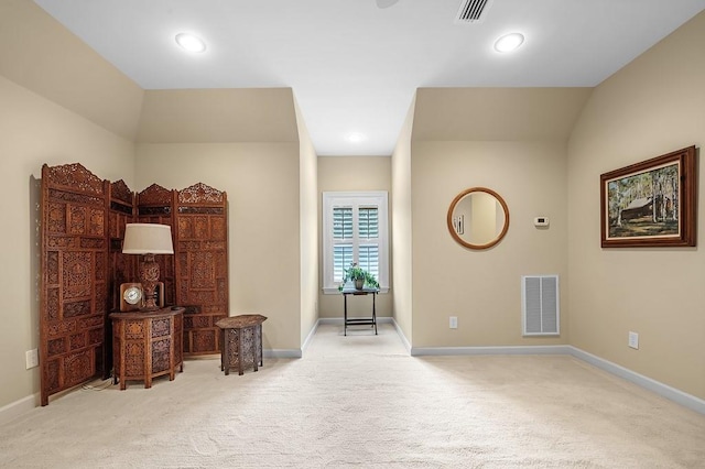 living area featuring light colored carpet