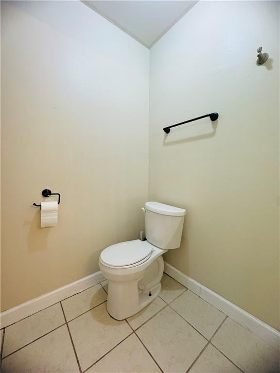 bathroom with tile patterned flooring and toilet