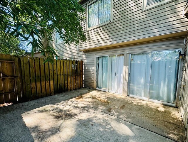 6701 Dickens Ferry Rd Unit 22, Mobile, AL 36608 - exterior space with a patio and fence
