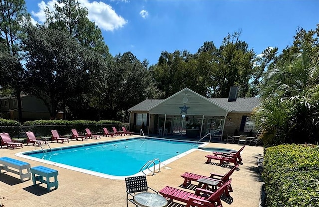 view of swimming pool with a patio