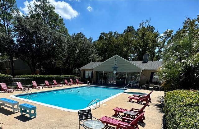 6701 Dickens Ferry Rd Unit 22, Mobile, AL 36608 - community pool featuring a patio and fence