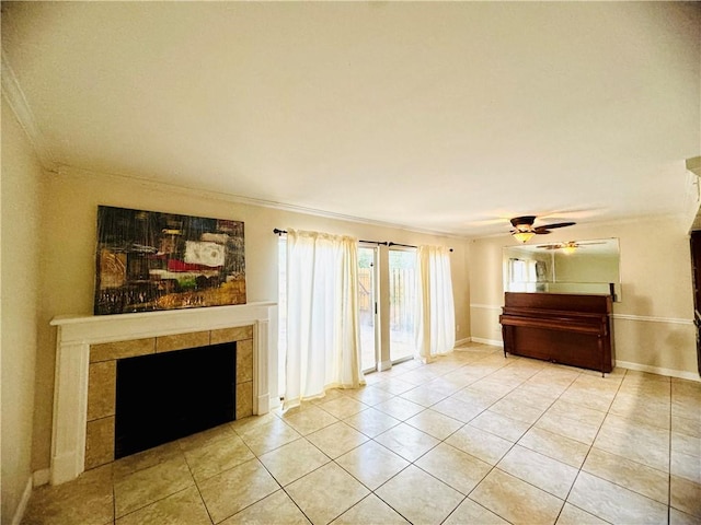 unfurnished living room featuring ceiling fan, a fireplace, crown molding, and light tile patterned floors