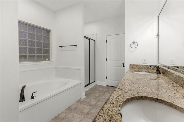 bathroom featuring vanity, independent shower and bath, and tile patterned flooring