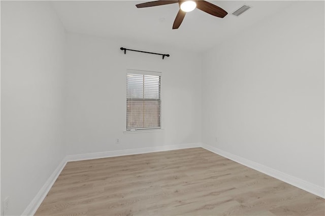 empty room featuring ceiling fan and light wood-type flooring