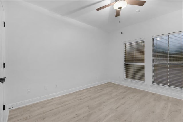 spare room with light hardwood / wood-style flooring and ceiling fan